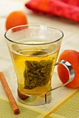 Green tea, apricots and cinnamon sticks