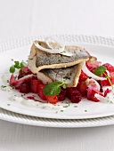Trout fillets on a beetroot salad