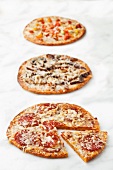 Three Assorted Pizzas; On White