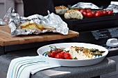 Grilled halibut with vine tomatoes and baked potatoes