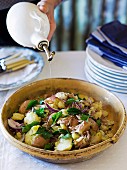 Rustic potato salad with red onions and parsley