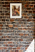 Impressionist painting on exposed brick wall