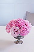 Pink Peonies in a Silver Vase on a Table