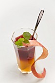 A rosehip drink with orange juice and apple peel