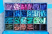 Colorful chalk in a metal box