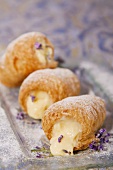 Puff pastry rolls filled with cream