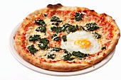 A spinach and fried egg pizza