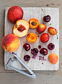 Summer fruits on a white wooden board