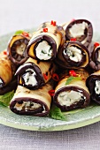 Grilled aubergines rolls with goat's cheese and chilli rings