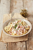 Spaghetti carbonara with capers