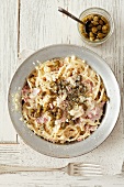 Spaghetti carbonara with capers and Parmesan
