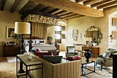 Side table with metal frame behind sofa in rustic interior with wood-beamed ceiling