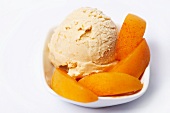 Apricot ice cream garnished with apricot wedges