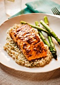 Salmon Fillet with Mustard Sauce Over Rice with Asparagus Spears