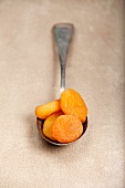 Dried apricots on a spoon