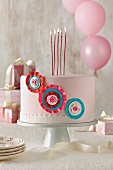 Pink Birthday Cake with Tall Lit Candles