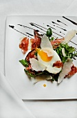Arugula with Fried Egg, Prosciutto, Shaved Parmesan, Toast and Balsamic Reduction