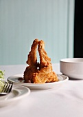 Fried Frog Legs on a White Plate
