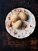 Three Smoked Duck Eggs on a Plate; From Above