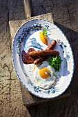 Venison sausages with fried egg