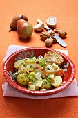 Winter salad with potatoes, pears and nuts