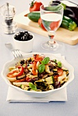 Penne pasta with vegetables and basil