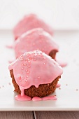 Cakes covered in pink icing