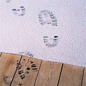 Black footprints on a carpet