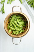 Soy beans in a bamboo steamer