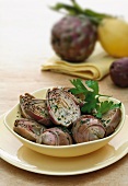 Steamed Artichokes on Plate with Herbed Olive Oil