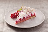 A slice of redcurrant tart with meringue