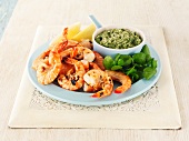 Grilled king prawns with a herb dip