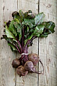 A fresh beetroot on a wooden surface