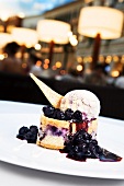 Individual Blueberry Tart with Fresh Blueberry Sauce and Vanilla Ice Cream