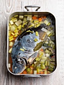 Poached carp with vegetables