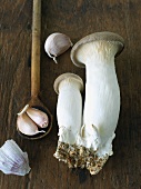 King Mushrooms with Garlic on a Cutting Board
