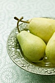 Pears on a green plate