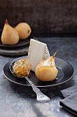 Pears poached in white wine, with goat's cheese and honeycomb