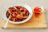 Sausage pieces in tomato sauce