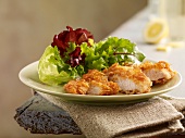 Turkey goujons with a cornflake crust and a mixed leaf salad