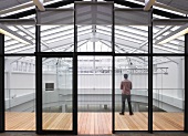 Modern office building with encircling gallery and glass and steel roof structure