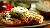 Grilled turkey escalope with melting herb butter