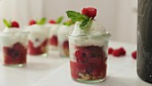 Frozen Prosecco yoghurt with raspberries and sponge cake being made