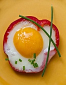 A stuffed pepper filled with a fried egg