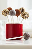Cake pops with various topping: sugar, cocoa powder and nuts