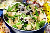 Pasta salad with olives and mange tout