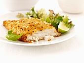 Breaded haddock with a mixed leaf salad