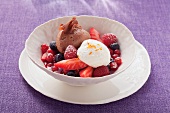 Light and dark mousse au chocolat with berries