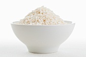 Round grain rice (risotto rice) in a white bowl