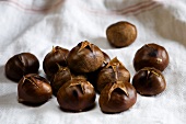 Roasted chestnuts on a tea towel